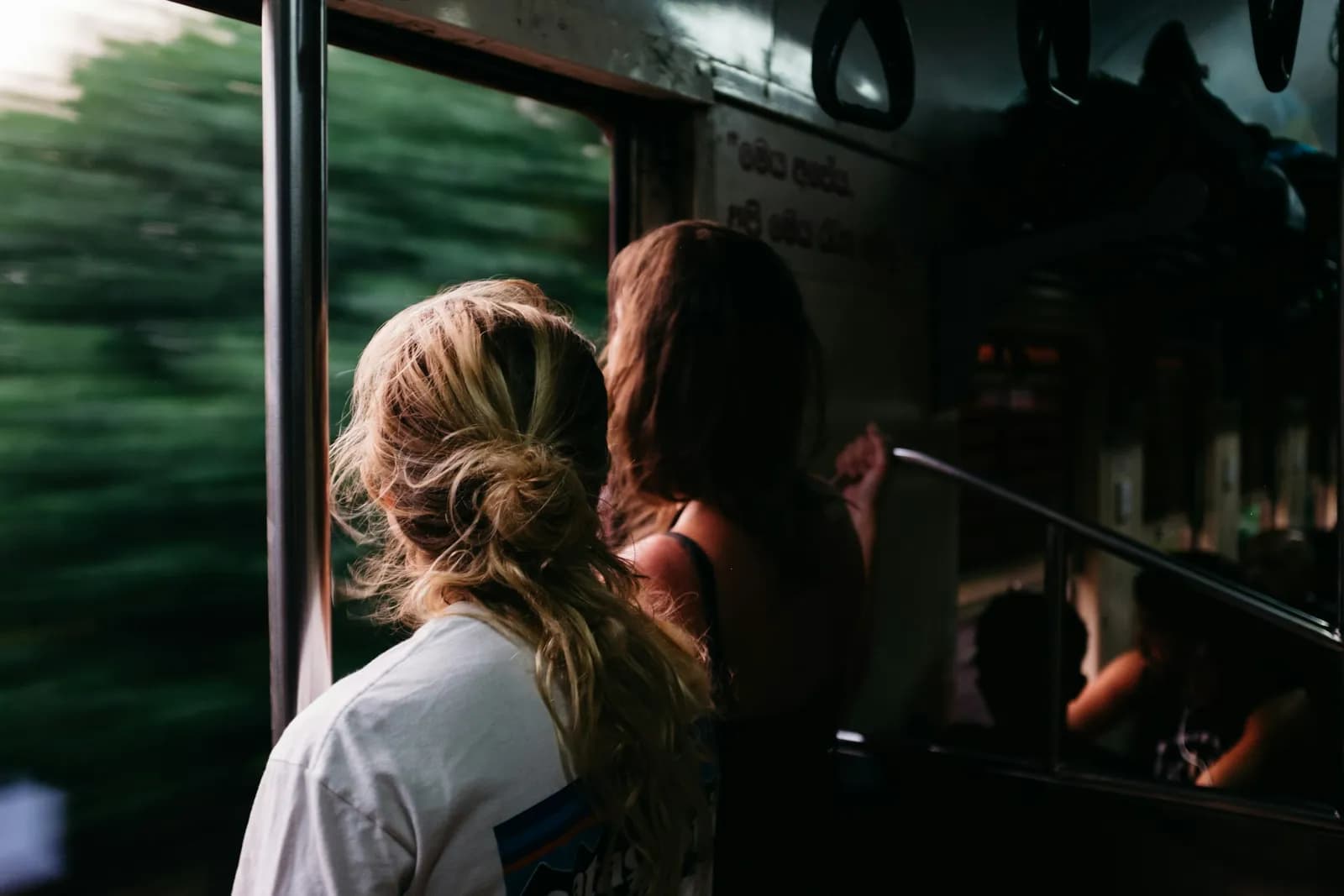 People Standing on Bus - Family Travel On A Budget