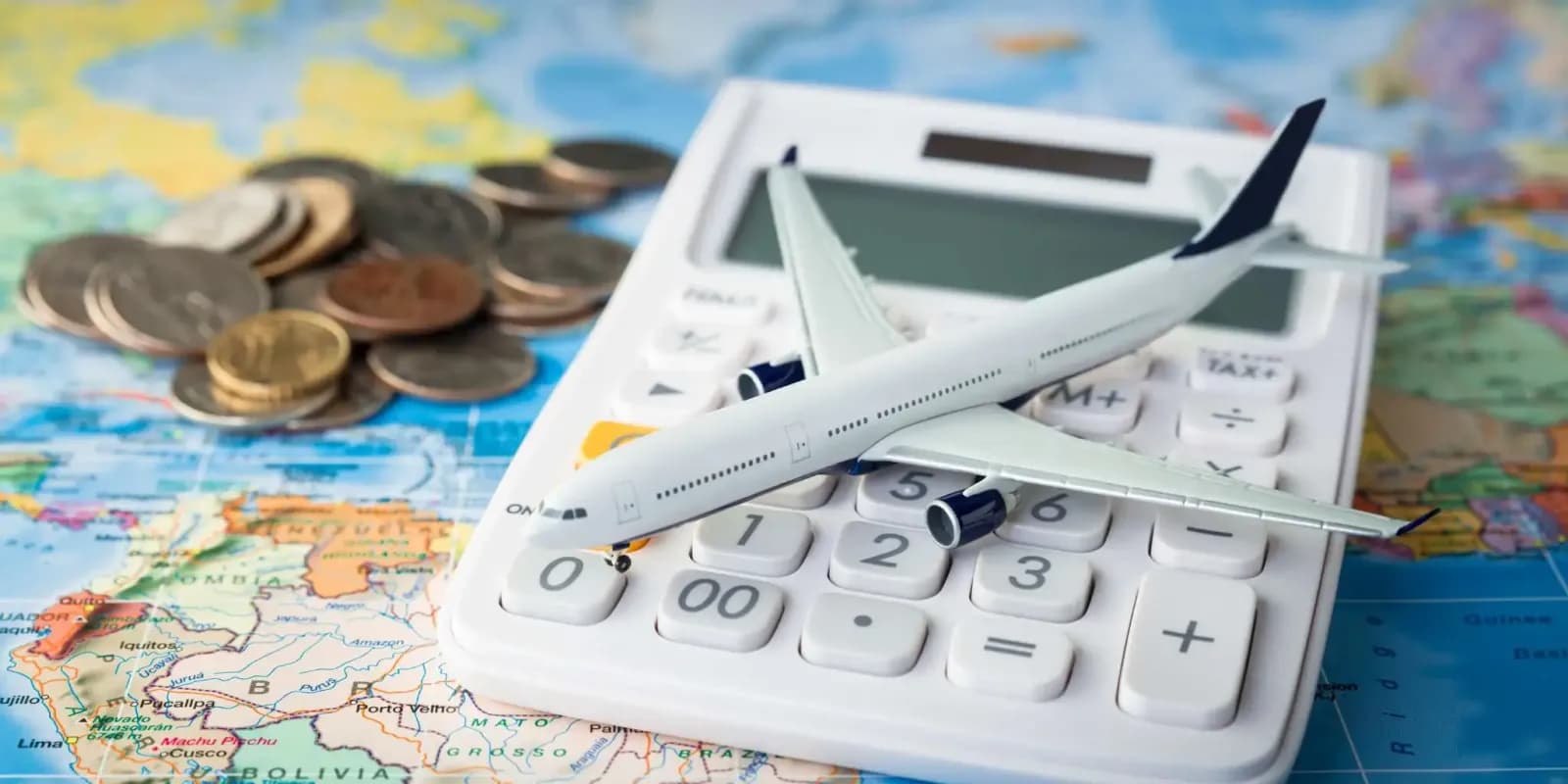 toy plane on a calculator - Best Way To Save For Travel